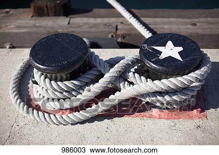 Rope tied to two bollards View Large Photo Image Stock Image - Rope tied to two bollards. Fotosearch