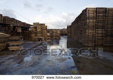 Stacks of wood pallets View Large Photo Image Stock Photo - Stacks of wood pallets. Fotosearch