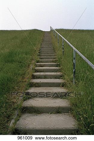Stairs up a grassy hill View Large Photo Image Stock Photo - Stairs up a grassy hill. Fotosearch