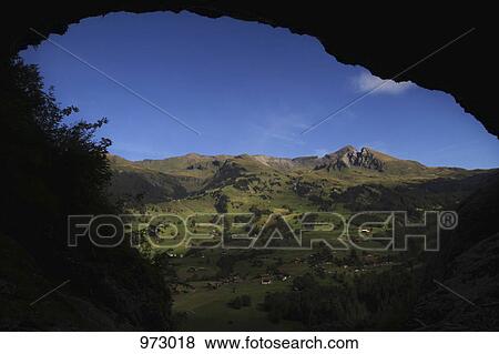 Swiss rural landscape framed by an arched rock View Large Photo Image Stock Photo - Swiss rural landscape framed by an arched rock. Fotosearch