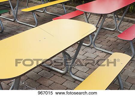 Stock Photography - Tables and benches on a patio. Fotosearch