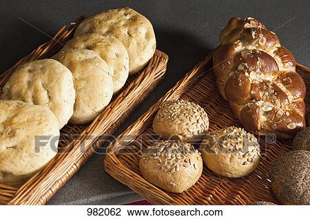The variety of bread offered in a bakery View Large Photo Image Stock Image - The variety of bread offered in a bakery. Fotosearch