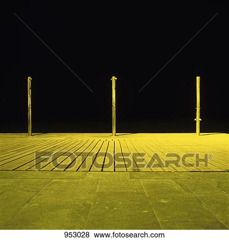 Stock Photo - Three outdoor showers at the beach. Fotosearch