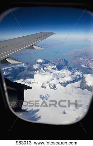 View from an airplane in flight View Large Photo Image Stock Image - View from an airplane in flight. Fotosearch