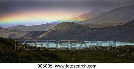 View of a rainbow over mountains and a lake, Torres del Paine National Park, Chile View Large Photo Image Stock Photography - View of a rainbow over mountains and a lake, Torres del Paine National Park, Chile. Fotosearch