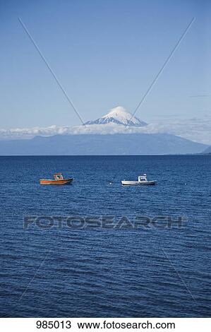 View of boats on Lake Llanquihue and Osorno Volcano, Puerto Varas, Chile View Large Photo Image Stock Image - View of boats on Lake Llanquihue and Osorno Volcano, Puerto Varas, Chile. Fotosearch