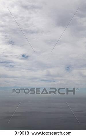 View of clouds in the sky above the ocean, Atlantic Ocean, Portugal View Large Photo Image Stock Photo - View of clouds in the sky above the ocean, Atlantic Ocean, Portugal. Fotosearch