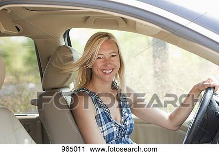 Stock Image - Woman in car. Fotosearch
