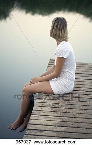 Woman on jetty View Large Photo Image Stock Photo - Woman on jetty . Fotosearch