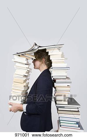 Woman surrounded by books View Large Photo Image Stock Image - Woman surrounded by books. Fotosearch
