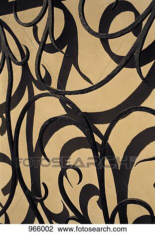 Stock Image - Wrought iron on a wall. Fotosearch