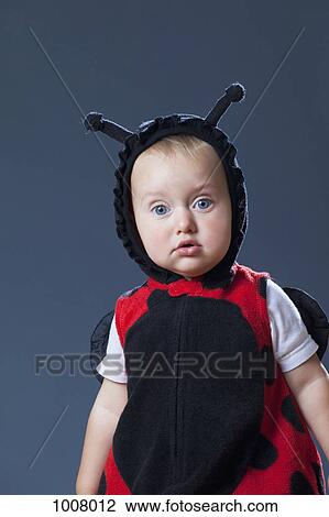 Stock Image - A baby boy in a ladybug costume. Fotosearch