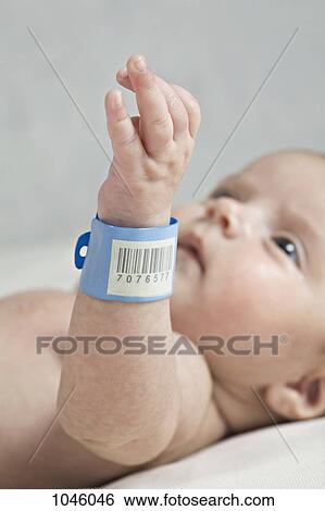 A baby with a hospital ID bracelet her wrist, focus on wrist View Large Photo Image Stock Photograph - A baby with a hospital ID bracelet her wrist, focus on wrist. Fotosearch