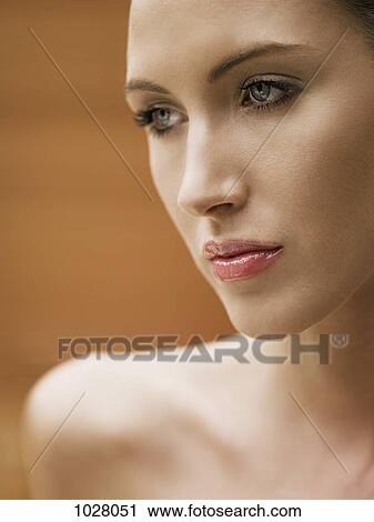 Stock Image - A beautiful woman looking away. Fotosearch