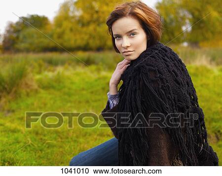 A beautiful woman wrapped in a shawl, outdoors View Large Photo Image Stock Image - A beautiful woman wrapped in a shawl, outdoors. Fotosearch