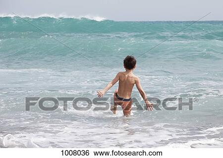 A boy in the sea View Large Photo Image Stock Photograph - A boy in the sea. Fotosearch