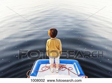 A boy standing at the edge of a floating jetty View Large Photo Image Stock Image - A boy standing at the edge of a floating jetty. Fotosearch