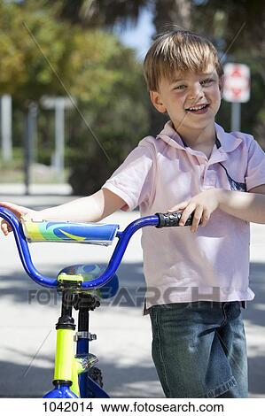 A boy with a bike View Large Photo Image Picture - A boy with a bike. Fotosearch