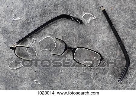 Picture - A broken pair of glasses. Fotosearch