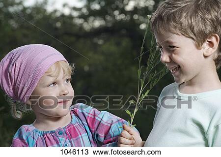 A brother teasing his little sister View Large Photo Image Stock Image - A brother teasing his little sister. Fotosearch