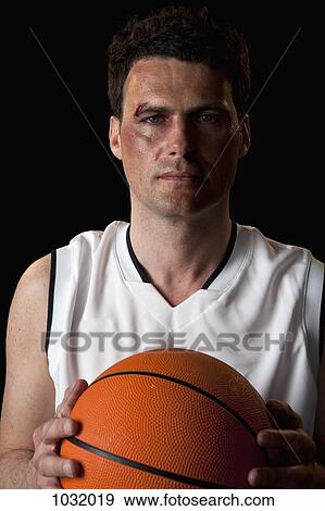 Stock Photo - A bruised basketball player, portrait. Fotosearch