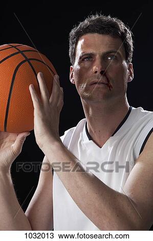 A bruised basketball player preparing to shoot a basket View Large Photo Image Stock Image - A bruised basketball player preparing to shoot a basket. Fotosearch