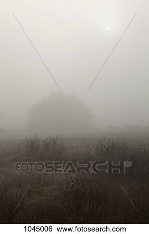 A building in a misty field View Large Photo Image Stock Photograph - A building in a misty field. Fotosearch