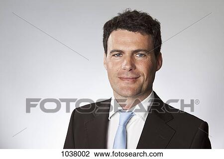 Stock Image - A businessman, head and shoulders, portrait. Fotosearch