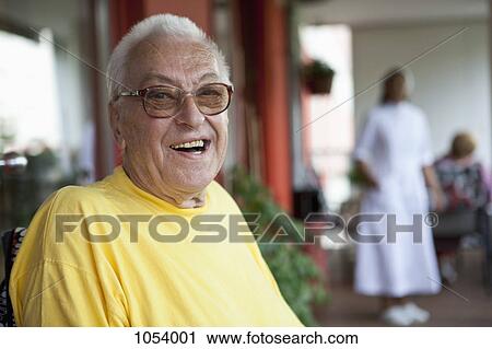 A cheerful senior man relaxing in a nursing home View Large Photo Image Stock Image - A cheerful senior man relaxing in a nursing home. Fotosearch
