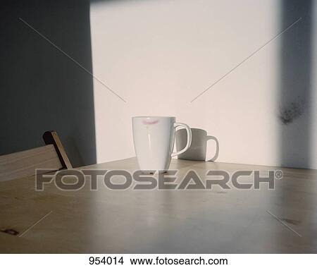 A coffee mug with a lipstick mark on it View Large Photo Image Picture - A coffee mug with a lipstick mark on it. Fotosearch