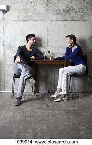 A couple enjoying a glass of wine in a restaurant View Large Photo Image Picture - A couple enjoying a glass of wine in a restaurant. Fotosearch