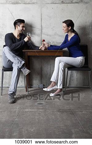 A couple enjoying a glass of wine in a restaurant View Large Photo Image Stock Image - A couple enjoying a glass of wine in a restaurant. Fotosearch