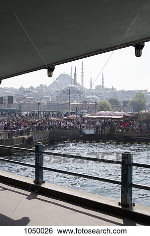 A crowd of people watching tour boats dock, Istanbul, Turkey View Large Photo Image Stock Photograph - A crowd of people watching tour boats dock, Istanbul, Turkey. Fotosearch