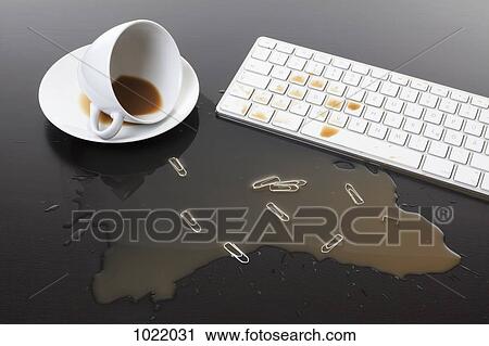 A cup of coffee spilled on a computer keyboard View Large Photo Image Stock Image - A cup of coffee spilled on a computer keyboard. Fotosearch