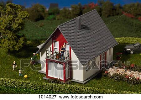 A diorama of a family of miniature figurines and their dollhouse View Large Photo Image Stock Photo - A diorama of a family of miniature figurines and their dollhouse. Fotosearch