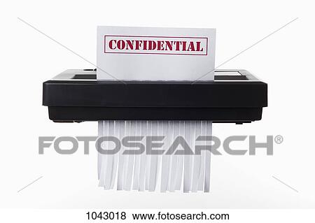 A document with CONFIDENTIAL on it being shredded in a paper shredder View Large Photo Image Stock Photo - A document with CONFIDENTIAL on it being shredded in a paper shredder. Fotosearch