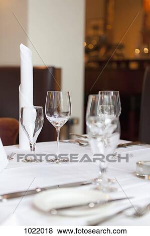 Stock Photo - A elegantly set dining table in a restaurant. Fotosearch