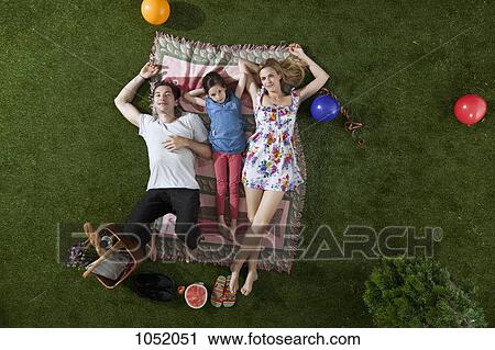 A family having a picnic in the park, overhead view View Large Photo Image Stock Image - A family having a picnic in the park, overhead view. Fotosearch