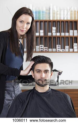 A hairdresser styling a customer's hair View Large Photo Image Stock Image - A hairdresser styling a customer's hair. Fotosearch