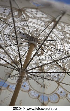 A lace parasol, low angle view, close-up, full frame View Large Photo Image Stock Photo - A lace parasol, low angle view, close-up, full frame. Fotosearch