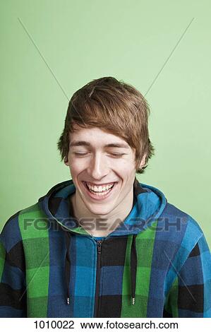 A laughing teenage boy, portrait, studio shot View Large Photo Image Stock Image - A laughing teenage boy, portrait, studio shot. Fotosearch
