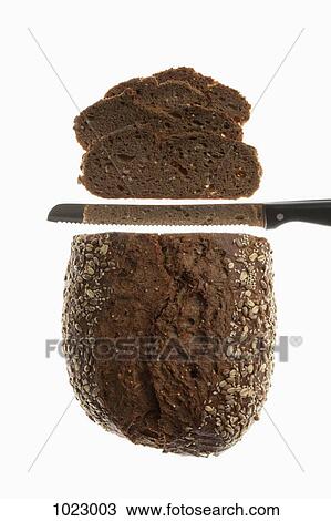 A loaf of bread, sliced with a bread knife View Large Photo Image Stock Image - A loaf of bread, sliced with a bread knife. Fotosearch
