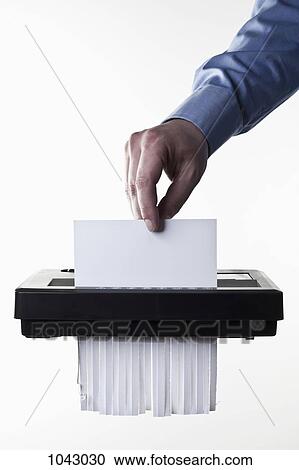 A man feeding a blank document into a paper shredder, close-up View Large Photo Image Stock Image - A man feeding a blank document into a paper shredder, close-up. Fotosearch