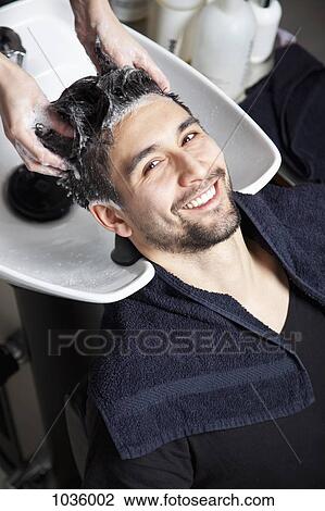 A man having his hair washed at a hair salon View Large Photo Image Stock Image - A man having his hair washed at a hair salon. Fotosearch
