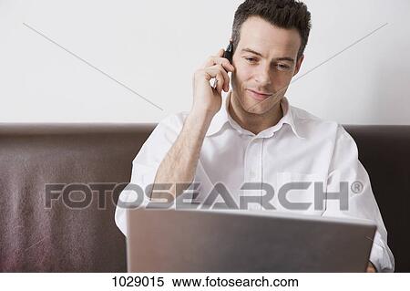 A man multitasking View Large Photo Image Stock Photography - A man multitasking. Fotosearch