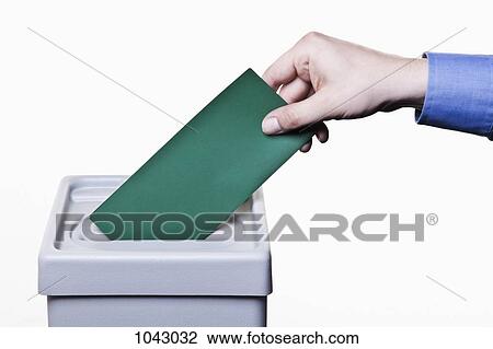 A man putting a blank green ballot into a ballot box, close-up hands View Large Photo Image Stock Image - A man putting a blank green ballot into a ballot box, close-up hands. Fotosearch