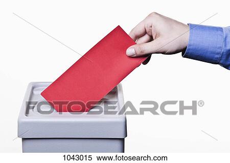 A man putting a blank red ballot into a ballot box, close-up hands View Large Photo Image Stock Photography - A man putting a blank red ballot into a ballot box, close-up hands. Fotosearch
