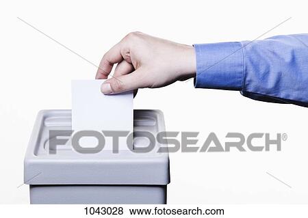 A man putting a blank white ballot into a ballot box, close-up hands View Large Photo Image Stock Photo - A man putting a blank white ballot into a ballot box, close-up hands. Fotosearch
