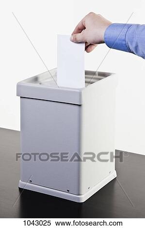 A man putting a blank white ballot into a ballot box, close-up hands View Large Photo Image Stock Photography - A man putting a blank white ballot into a ballot box, close-up hands. Fotosearch