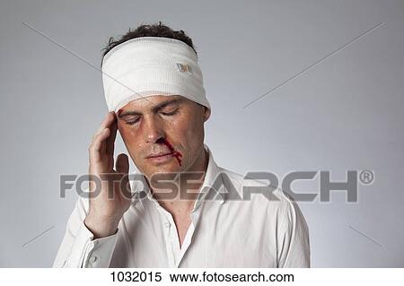 A man with bruises, a bloody nose and a bandaged head View Large Photo Image Stock Photography - A man with bruises, a bloody nose and a bandaged head. Fotosearch